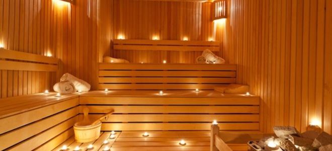 Cozy wooden sauna with benches, showcasing a traditional setting for health and relaxation